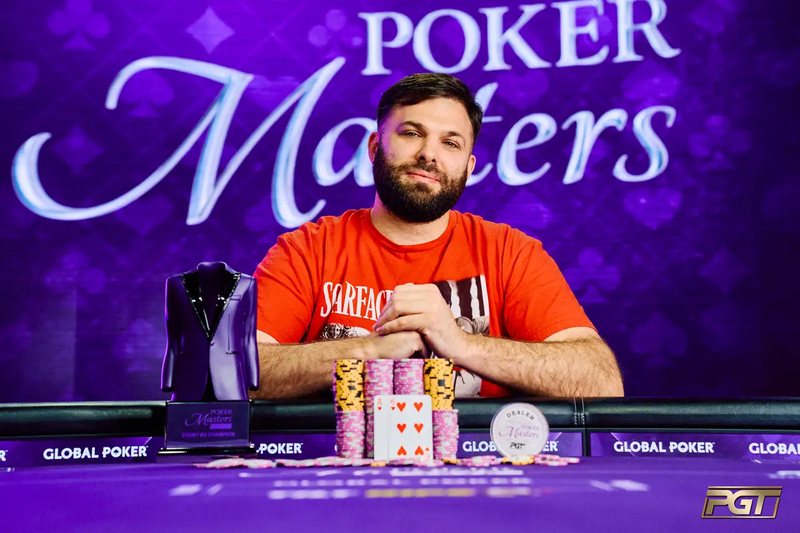Nick Palma at the Poker Masters final table with the Event #2 trophy and his winning chips